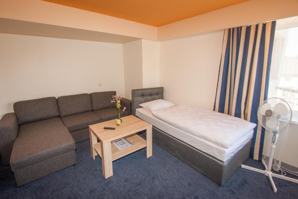 Lova arba lovos apgyvendinimo įstaigoje Tauras Center Hotel