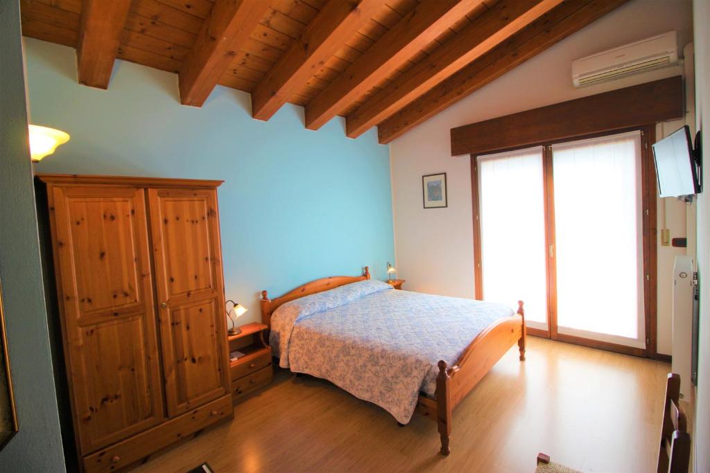 Postel nebo postele na pokoji v ubytování Ai Casali
