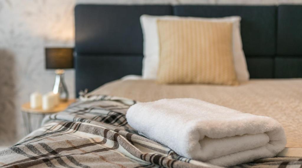Posteľ alebo postele v izbe v ubytovaní Finale Apartments