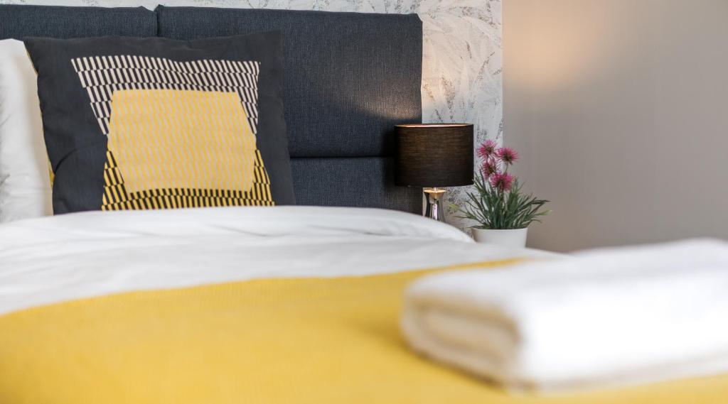 Posteľ alebo postele v izbe v ubytovaní Finale Apartments