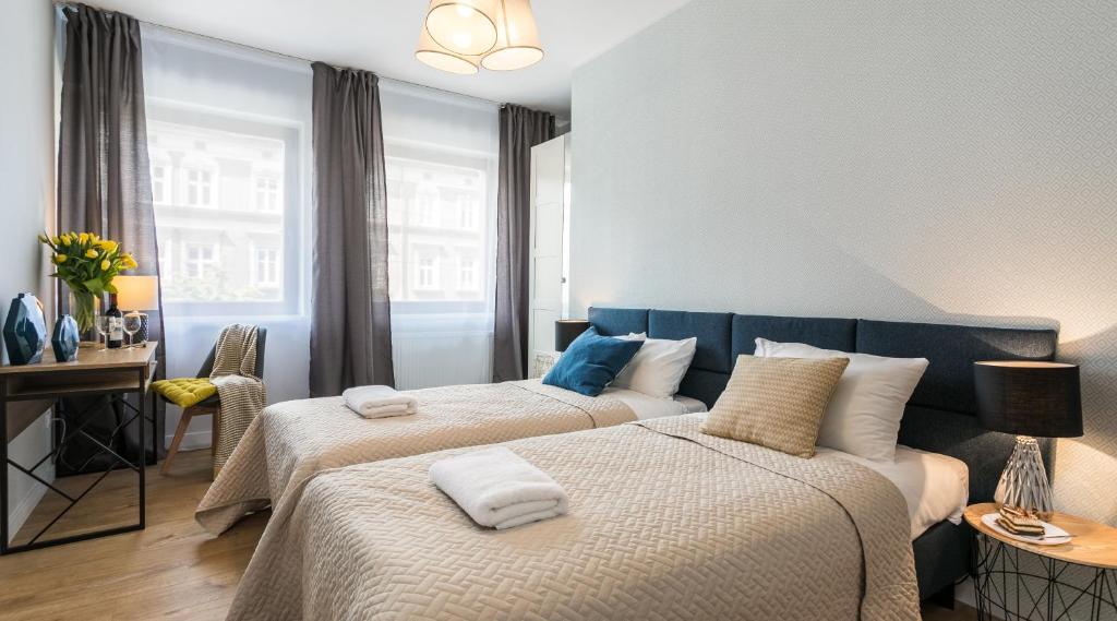 Posteľ alebo postele v izbe v ubytovaní Finale Apartments