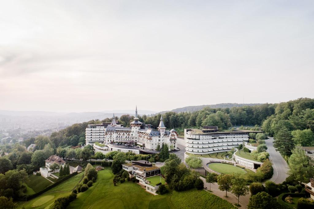 an aerial view of a large building on a hill at The Dolder Grand - City and Spa Resort Zurich in Zurich