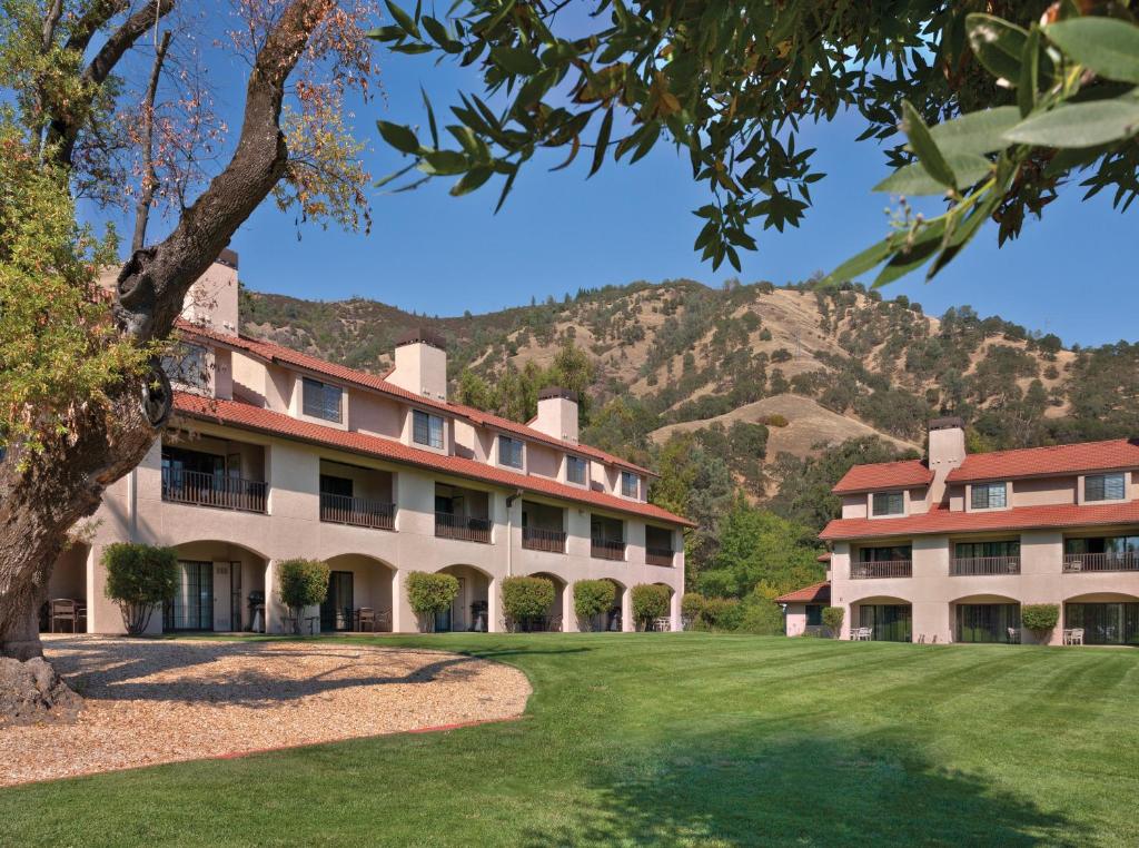 an exterior view of a building with mountains in the background at WorldMark Clear Lake in Nice