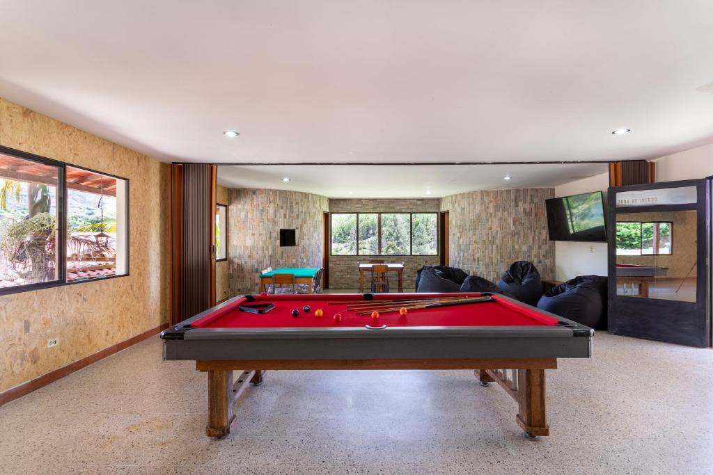 a living room with a pool table in it at Soy Local Guatape in Guatapé