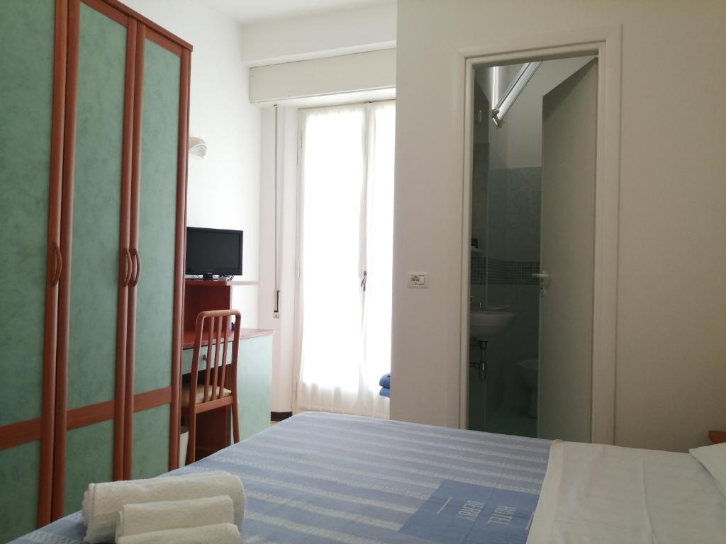 Postel nebo postele na pokoji v ubytování Hotel Derby