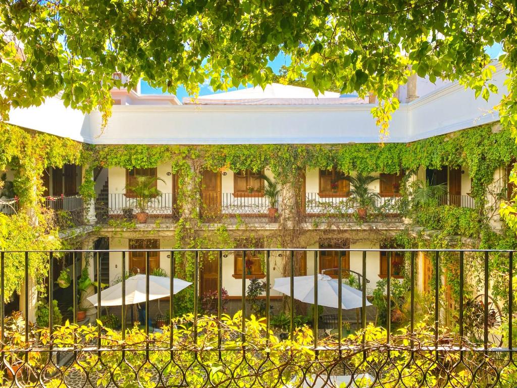 a building with a fence in front of it at El Carmen Suites in Antigua Guatemala