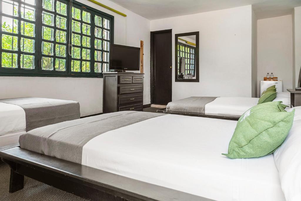 Postel nebo postele na pokoji v ubytování Hotel Premium Real