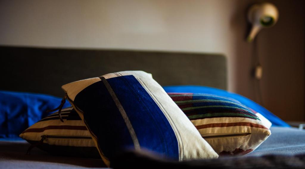 Postel nebo postele na pokoji v ubytování Boutique Hotel Al Palazzo Rosso