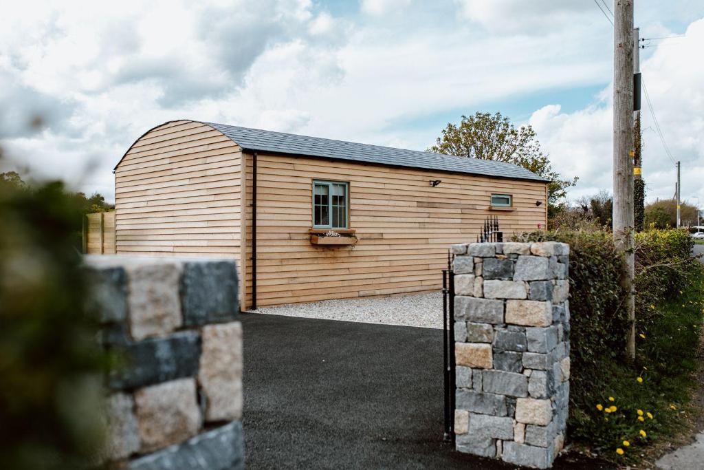 a wooden building with a gate in front of it at View 44 Newcastle in Newcastle