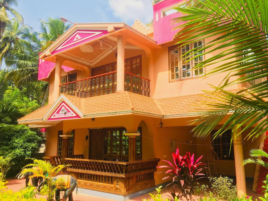 an elephant standing in front of a house at Ganesh House Ayurveda Homestay in Kovalam