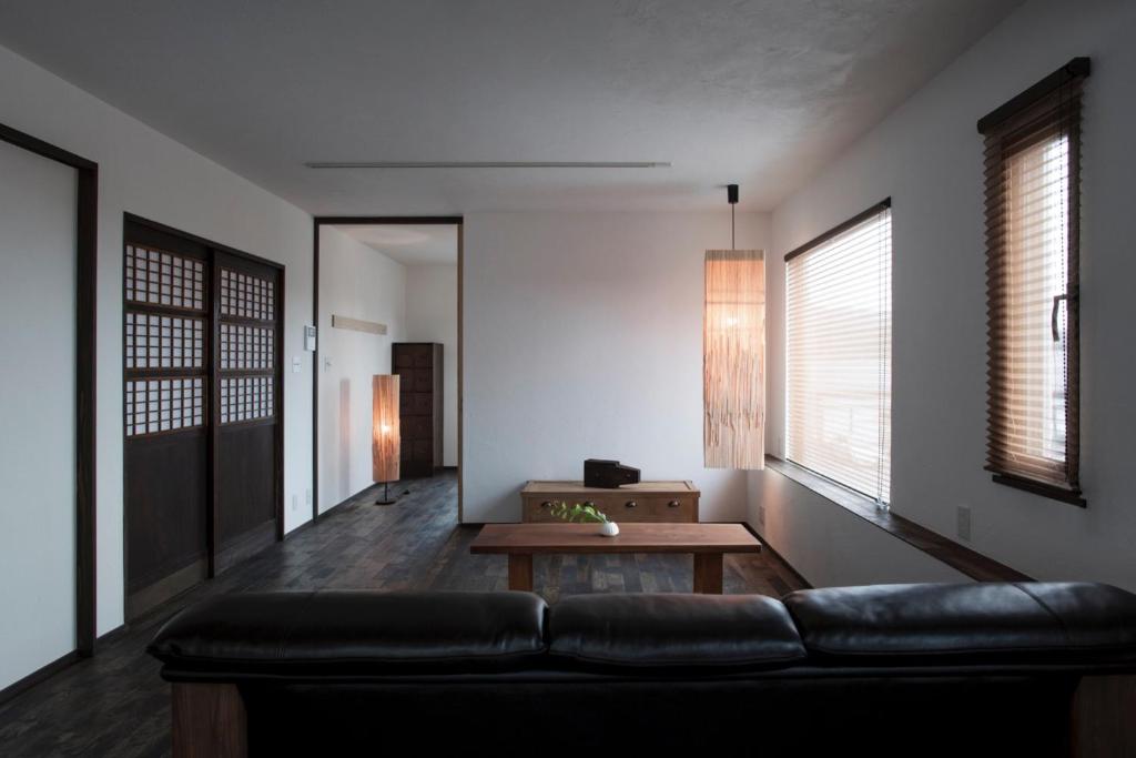 a living room with a couch and a table at Nikko, Matsubara no Yado - Vacation STAY 31914v in Nikko