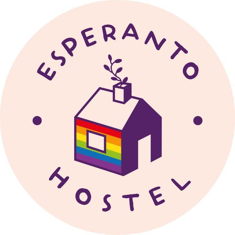 a house with a plant in the roof and the words emergency house at Esperanto hostel in Salta