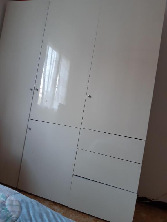 Łóżko lub łóżka w pokoju w obiekcie Sandra Camporosso