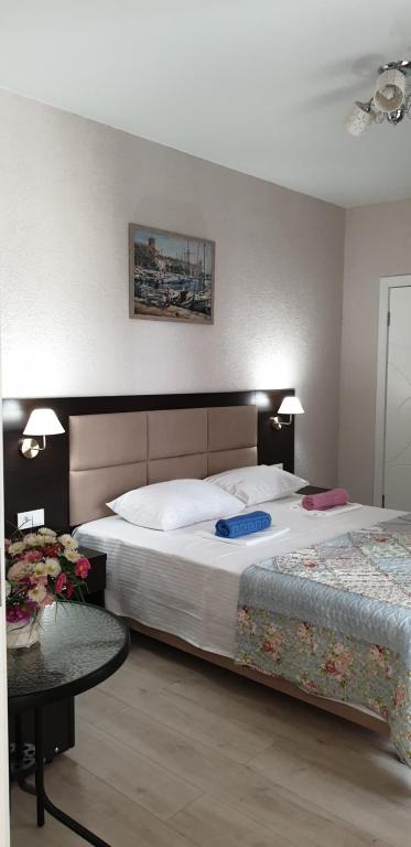 Ένα ή περισσότερα κρεβάτια σε δωμάτιο στο House in Gelendzhik centre