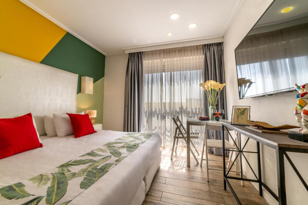 Postel nebo postele na pokoji v ubytování Paamonim Hotel Jerusalem