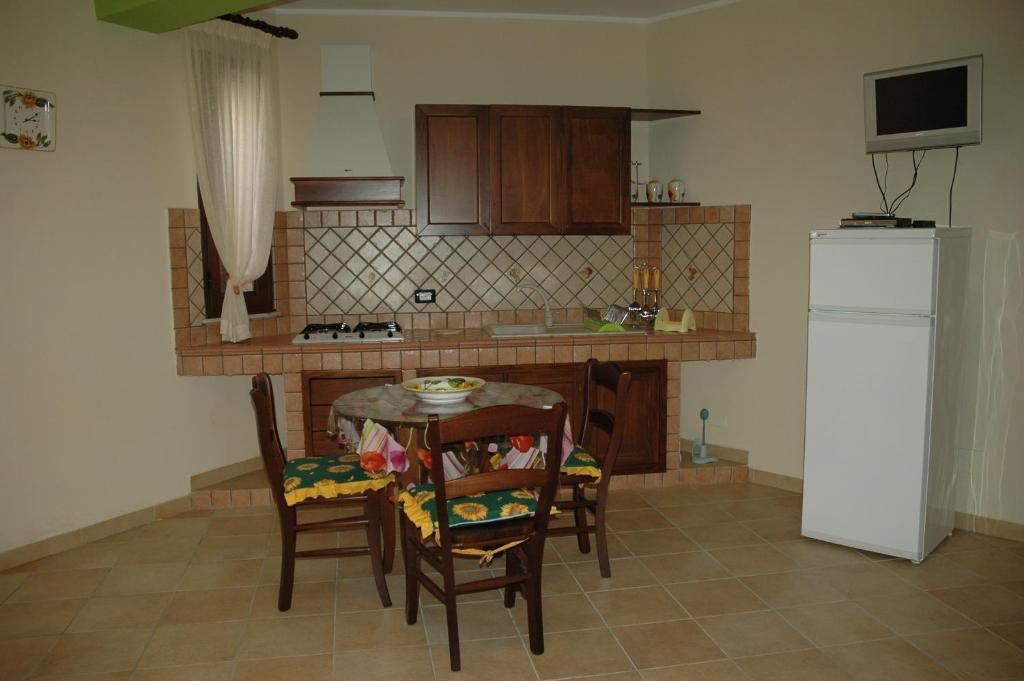 Kuchyň nebo kuchyňský kout v ubytování Puesta De Sol Residence