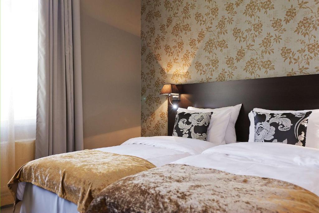 Postel nebo postele na pokoji v ubytování Saga Hotel Oslo, WorldHotels Crafted