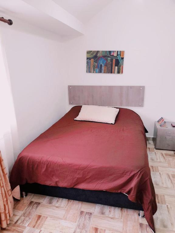 Postel nebo postele na pokoji v ubytování Hospedaje Sary House