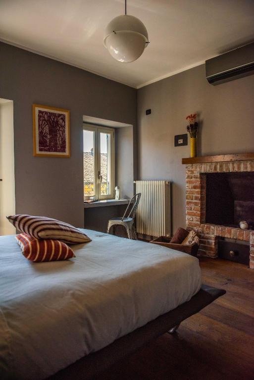 Postel nebo postele na pokoji v ubytování Boutique Hotel Al Palazzo Rosso