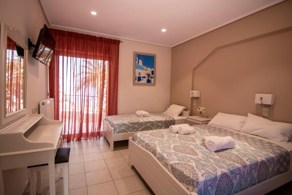 A bed or beds in a room at Nefeli Studios