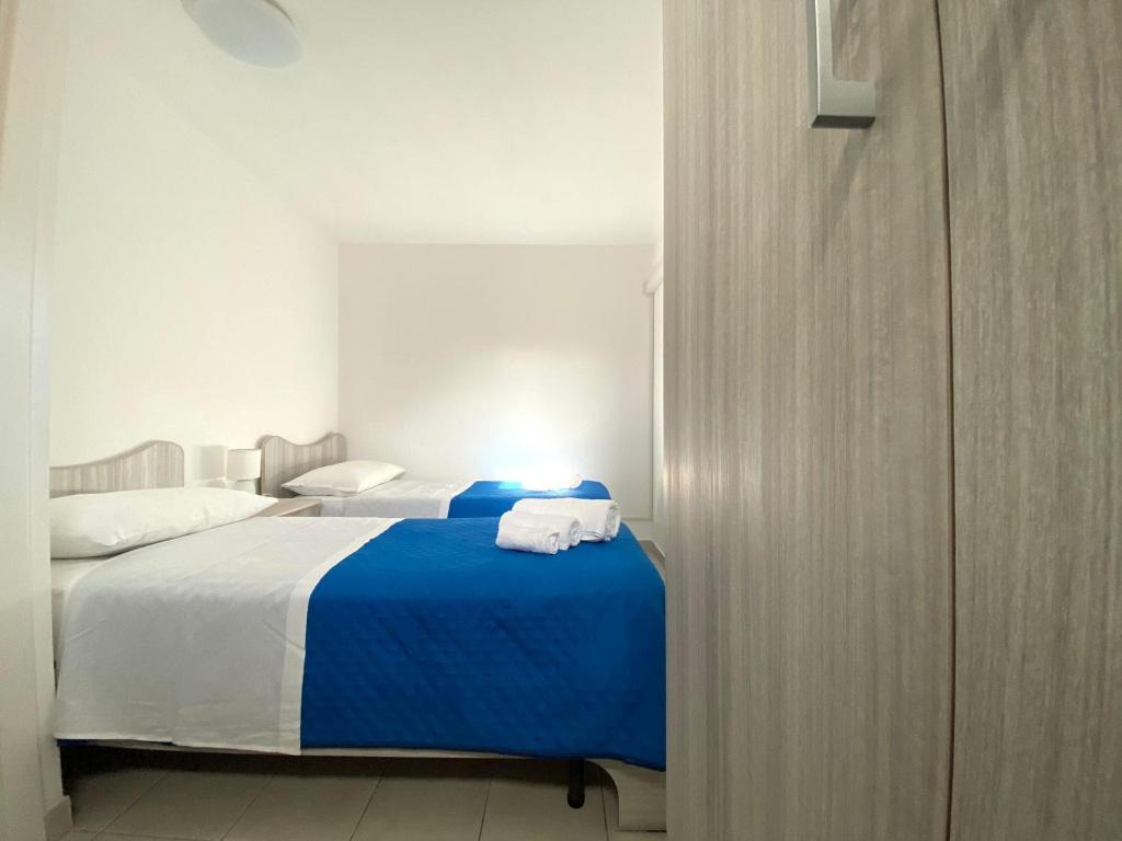 Łóżko lub łóżka w pokoju w obiekcie Galatea House