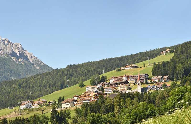 a small village on a hill in the mountains at Aurturist Valdaora Roulette in Valdaora