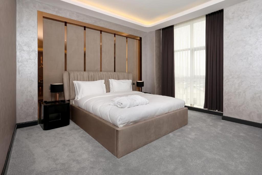 Кровать или кровати в номере Aileena Hotel & Villas