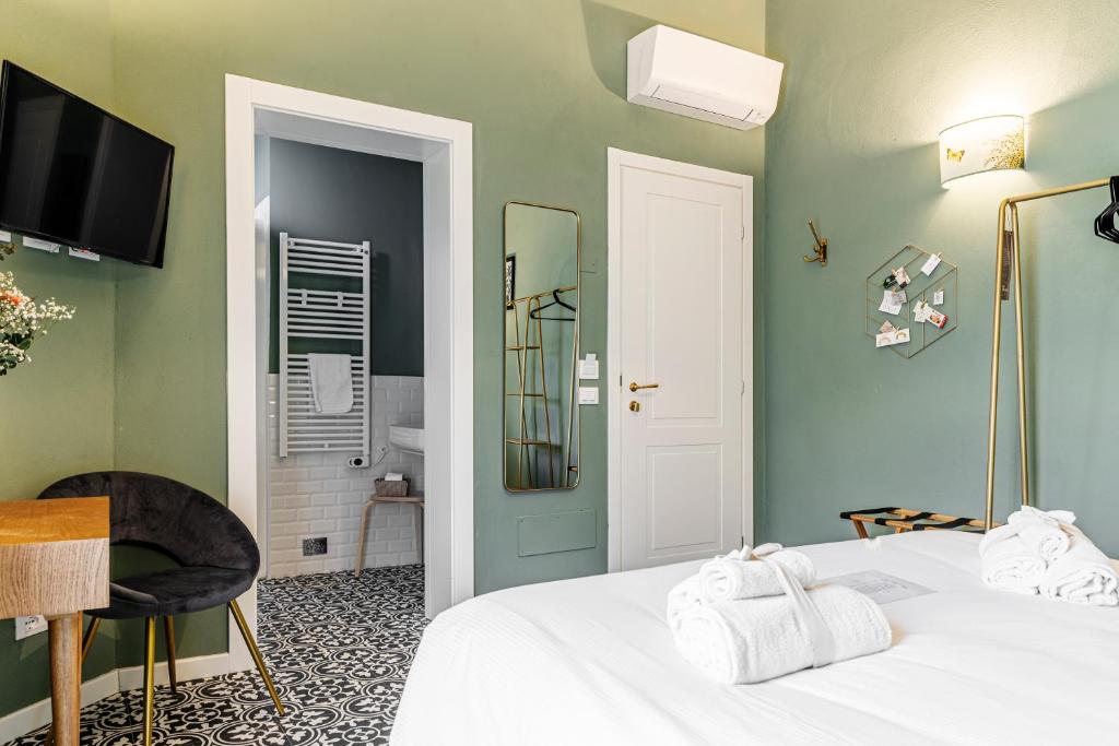 Łóżko lub łóżka w pokoju w obiekcie La Lu cozy rooms 2