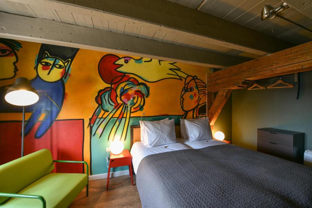 Postel nebo postele na pokoji v ubytování Hotel De Gravin