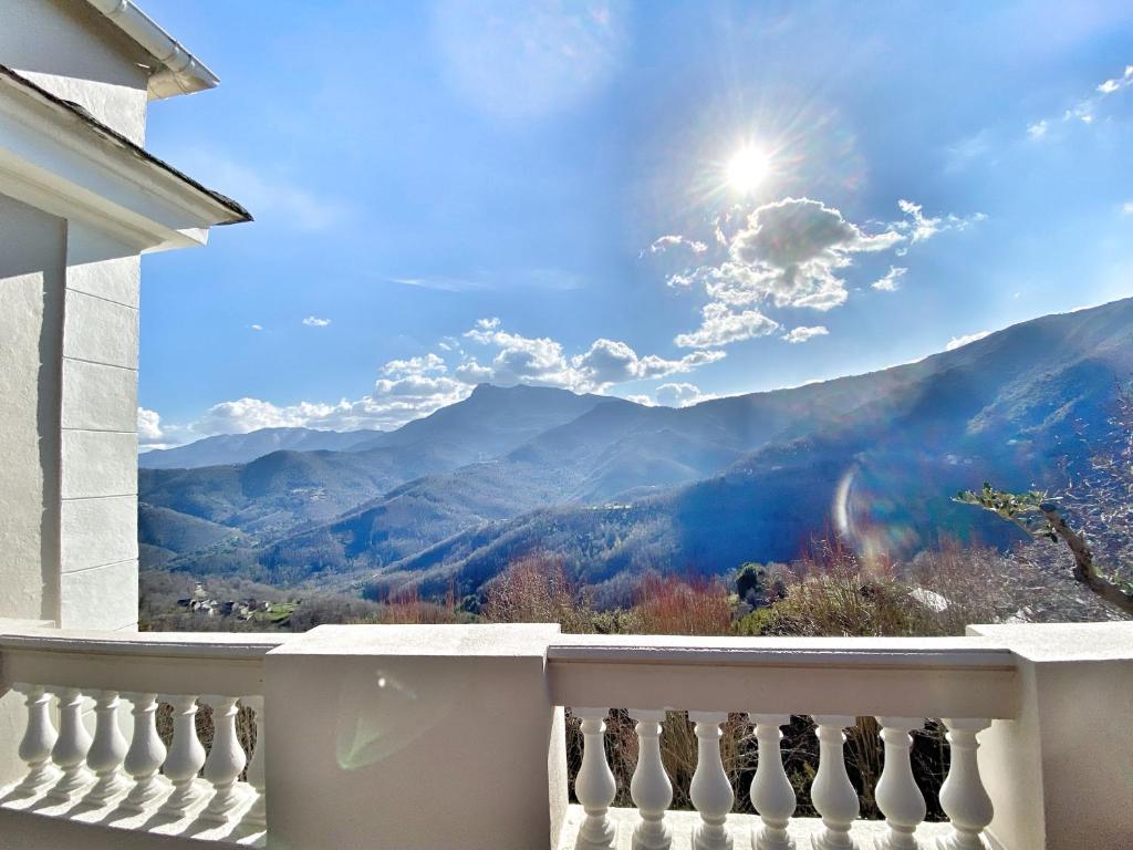 a balcony with a view of the mountains at U Castellu di A Sulana in Casabianca