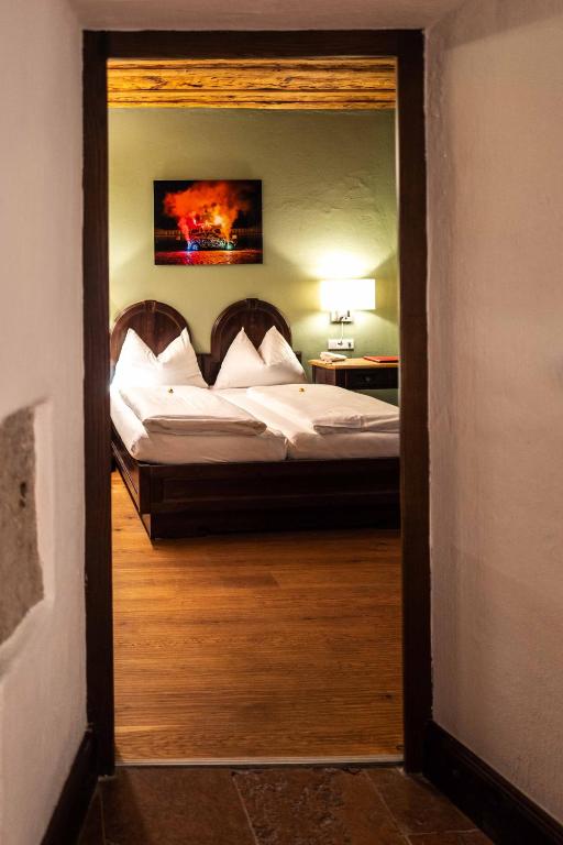 Postel nebo postele na pokoji v ubytování Altstadt Hotel Stadtkrug