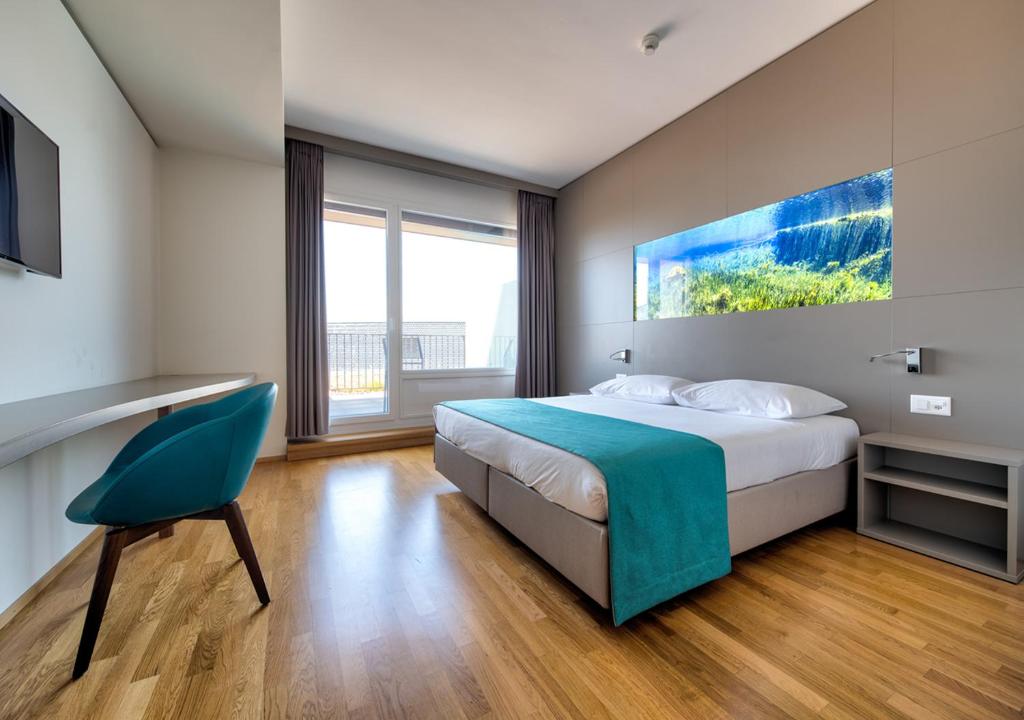 Postel nebo postele na pokoji v ubytování Aquatis Hotel