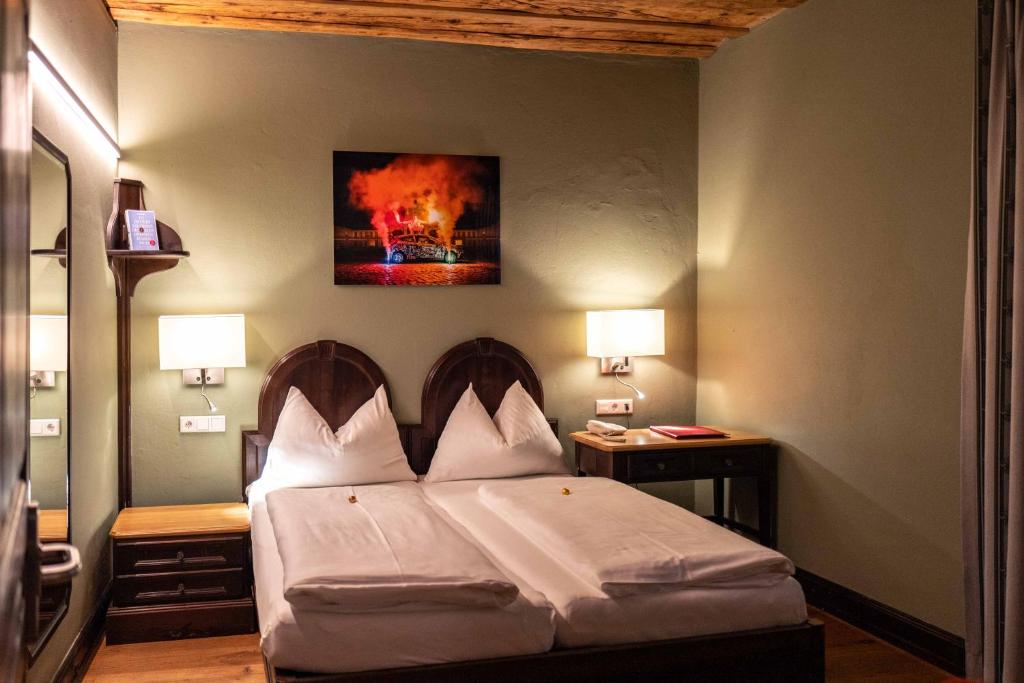 Postel nebo postele na pokoji v ubytování Altstadt Hotel Stadtkrug