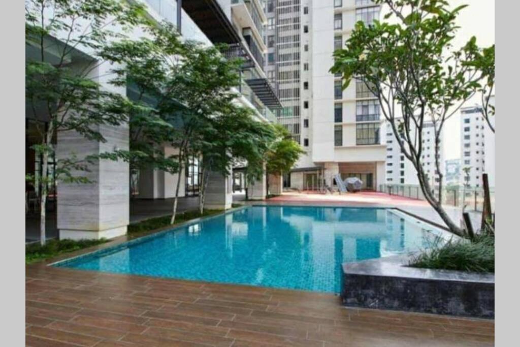 a large swimming pool in the middle of a building at Luxury Apartment The Elements Ampang in Kuala Lumpur