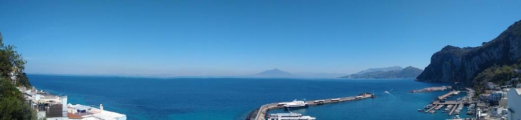 a large body of water with boats in it at Soleluna in Capri