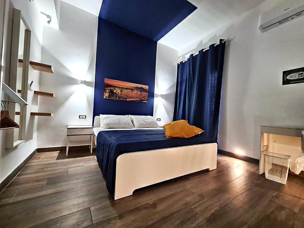 Säng eller sängar i ett rum på City Focus Apartments Napoli