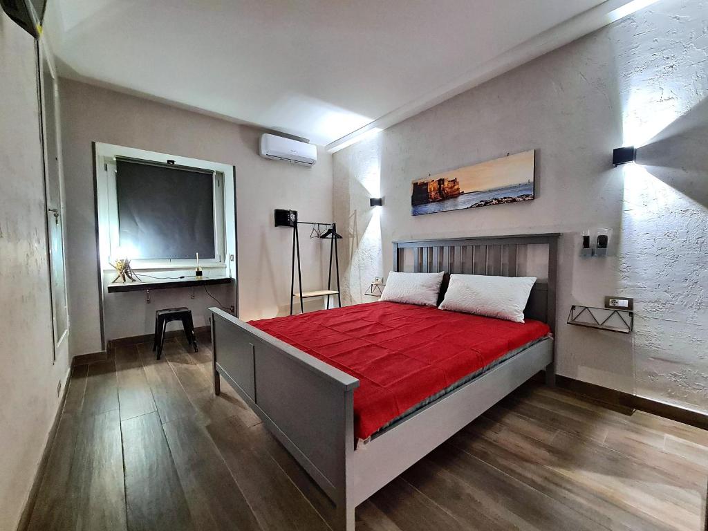 A bed or beds in a room at City Focus Apartments Napoli