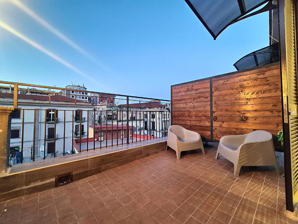 A balcony or terrace at City Focus Apartments Napoli