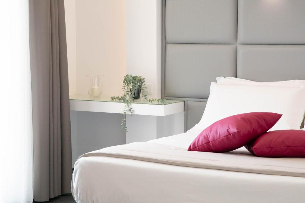 Postel nebo postele na pokoji v ubytování GRAND HOTEL SERAPIDE