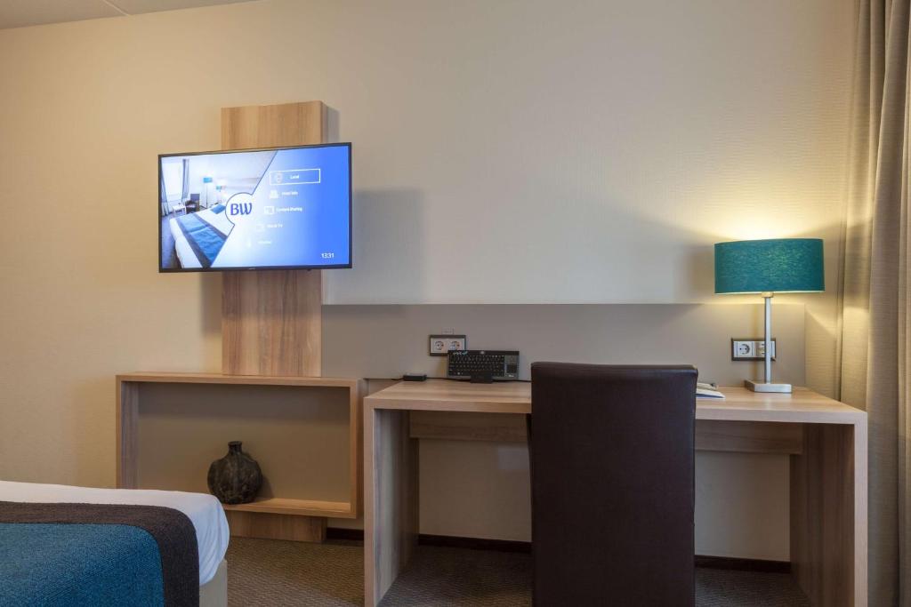 TV a/nebo společenská místnost v ubytování Best Western Hotel Baars