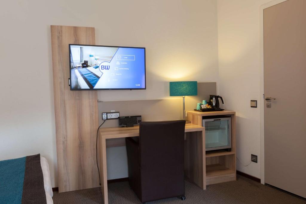 TV a/nebo společenská místnost v ubytování Best Western Hotel Baars