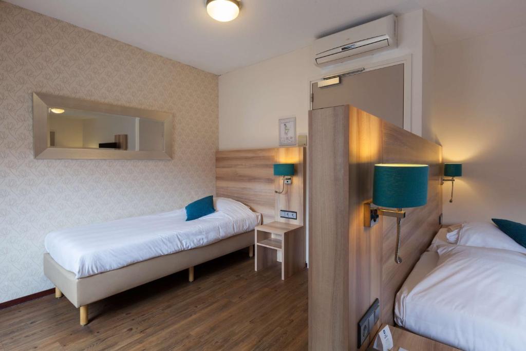Postel nebo postele na pokoji v ubytování Best Western Hotel Baars