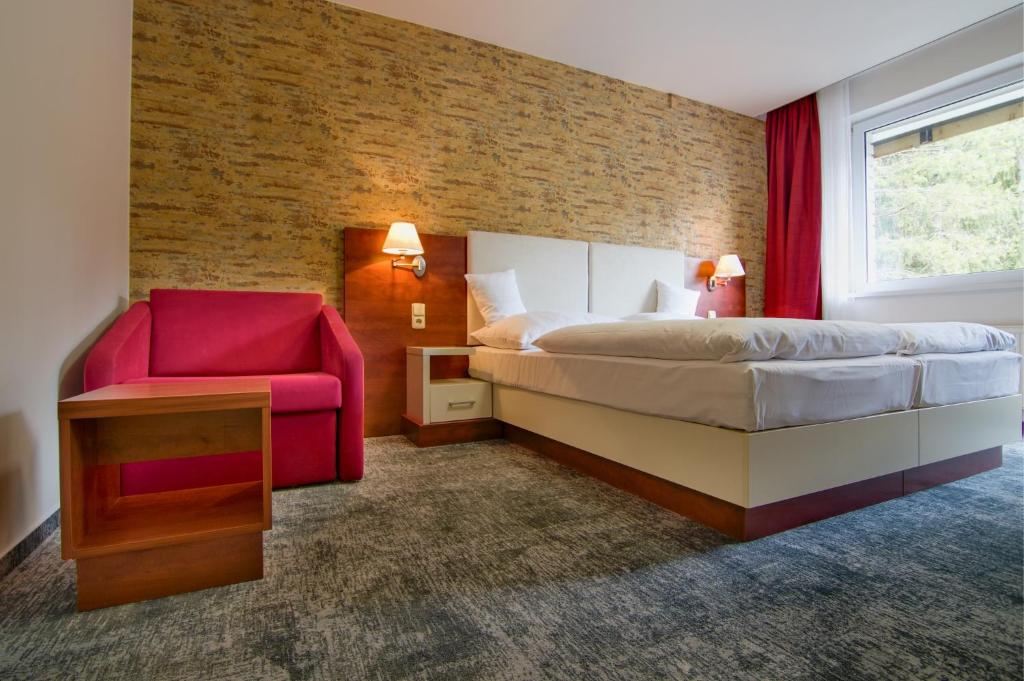 Postel nebo postele na pokoji v ubytování Hotel Srní a Depandance