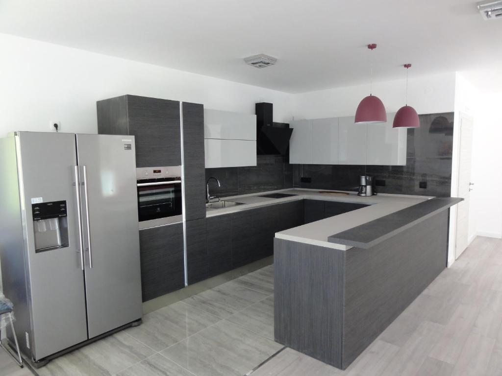 Kuchyň nebo kuchyňský kout v ubytování Villa Riva