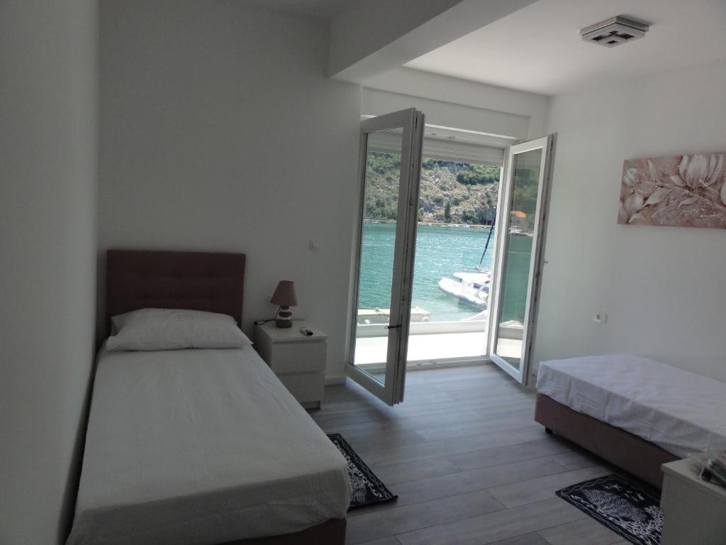 Postel nebo postele na pokoji v ubytování Villa Riva