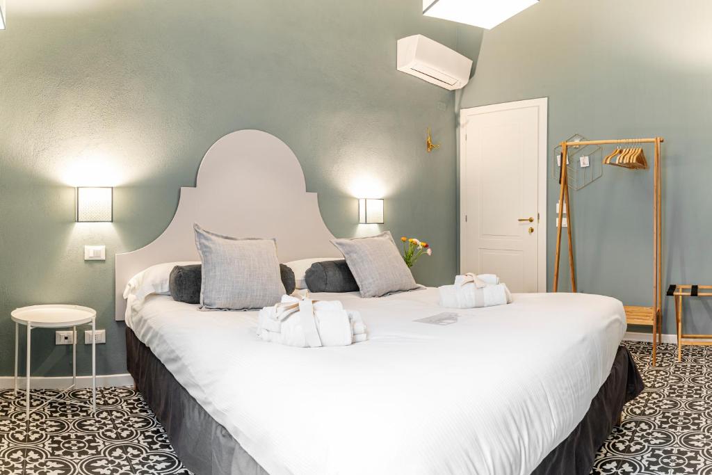 Łóżko lub łóżka w pokoju w obiekcie La Lu cozy rooms 2