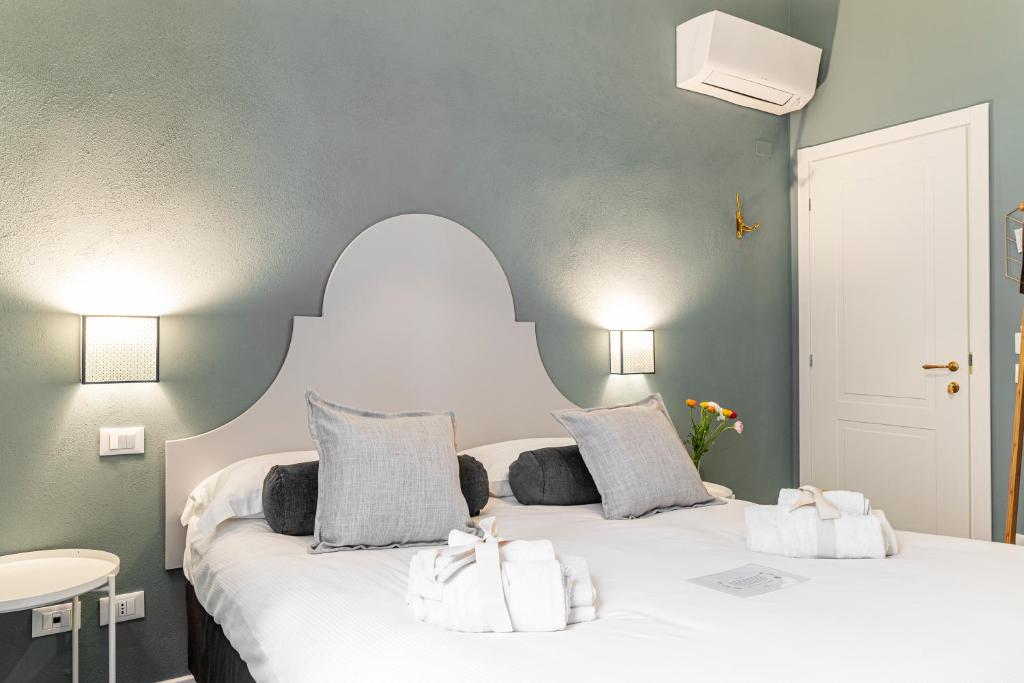 Łóżko lub łóżka w pokoju w obiekcie La Lu cozy rooms 2