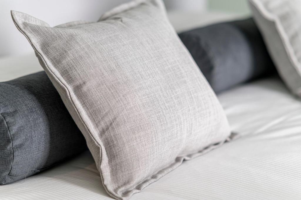 Łóżko lub łóżka w pokoju w obiekcie La Lu cozy rooms 2