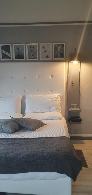 Postel nebo postele na pokoji v ubytování Hotel Zia Piera