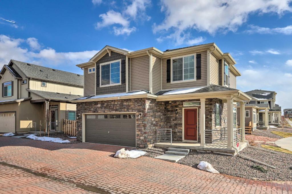 a house with a brick driveway at Modern Aurora Getaway 22 Mi to Downtown Denver in Watkins